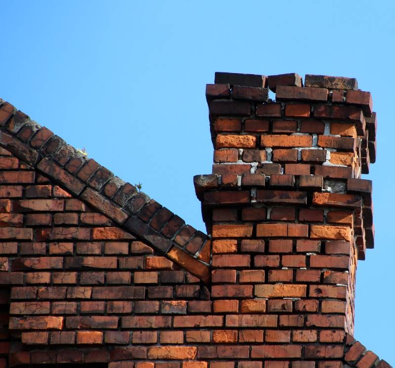 Signs Your Montgomery Village Home Needs a Chimney Inspection Damaged chimney on an Montgomery Village home showing cracks and missing mortar